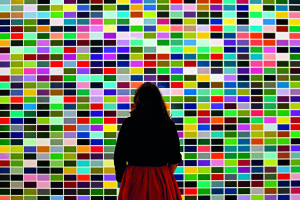 A woman looks at a painting entitled "10